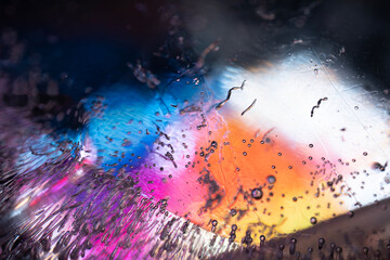Macro Texture of Melting Ice Crystals Over Vibrant Rainbow Backg