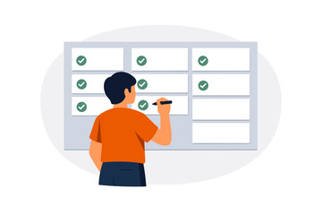 Young male planning tasks on whiteboard with checklist and markers