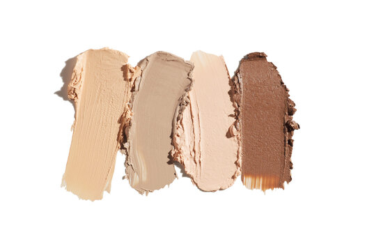 Cosmetic concealer or foundation medium colored smudge assortment set palette on isolated white background