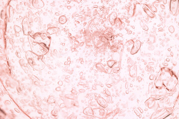 Cosmetic orange texture gel smudge background. Beauty product sample swatch.