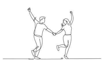 Fototapeta premium Joyful couple holds hands and dances in unison with raised arms.