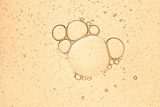 Cream gel yellow orange collagen retinol vitamin c peptides transparent cosmetic sample texture with bubbles