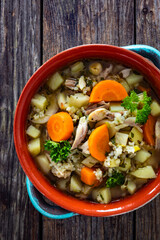 Krupnik - polish barley soup with chicken. Top view