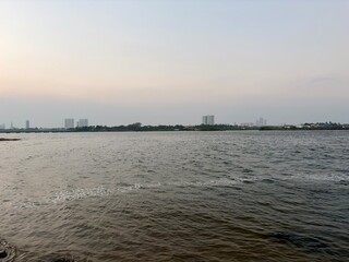 Sunset over the sea. Waterfront scene.