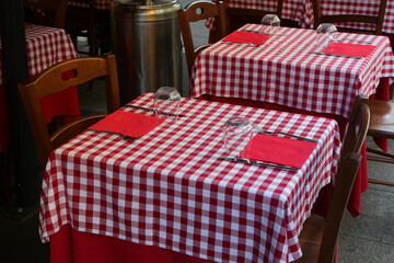 red and white checkered tablecloth on wooden table in cafe © ChiccoDodiFC