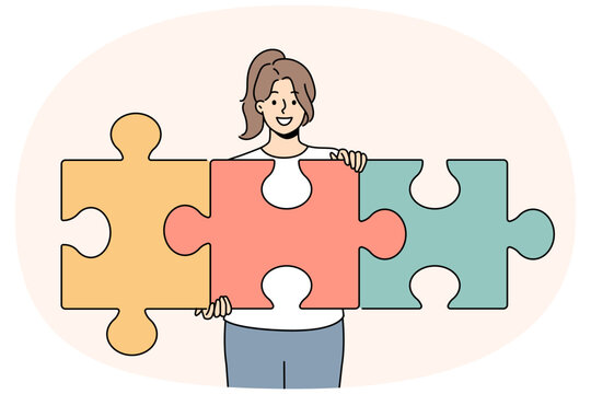 Successful woman unraveling puzzle and solving complex task while developing own startup. Smart girl with smile demonstrates problem solving skills and ability to create team for business.