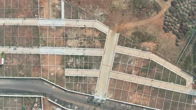 Aerial View of Emerging Development Area Near Bangalore &ndash; Planned Residential Plots, New Road Infrastructure, and Urban Expansion Toward Hosur and Devanahalli Corridors