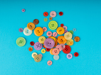 Multicolored sewing buttons. Plastic sew buttons of different colors and sizes