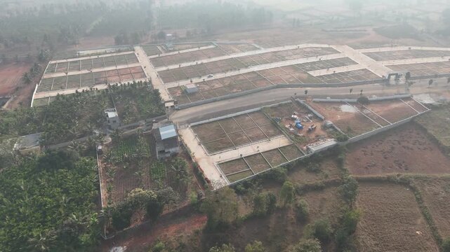 Aerial View of Emerging Development Area Near Bangalore &ndash; Planned Residential Plots, New Road Infrastructure, and Urban Expansion Toward Hosur and Devanahalli Corridors