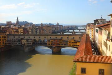 aerial view of the ponte vecchio over the arno river in florence and the covered path known as vasari corridor