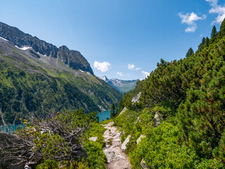 Climb the trail from the Zillergr&uuml;ndl reservoir to the Plauener Hut.