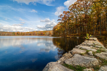 Sawmill Lake in High Point State Park, NJ, on a beautiful Autumn afternoon surrounded by colorful fall foliage