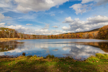 Sawmill Lake in High Point State Park, NJ, on a beautiful Autumn afternoon surrounded by colorful fall foliage