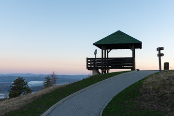Wooden summer house with binoculars at Gradina peak at Zlatibor mountain, visit Serbia