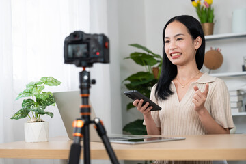 Content Creator in Action: A vibrant woman creates engaging content, skillfully using a camera, smartphone, and laptop to connect with her audience and share her insights.