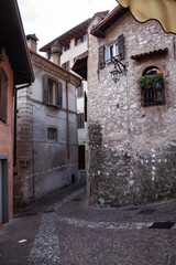 Street view from famous italian old town Limone on the coast of Garda lake