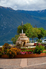 Fountain in the coast of town Limone sul Garda, on the coast of lake Garda, Italy 
