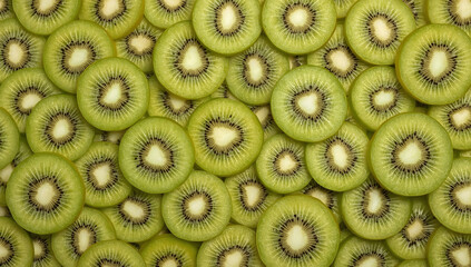 Green textured background of sliced kiwi fruit perfect for food blogs, healthy lifestyle websites, recipe cards, or organic skincare labels.