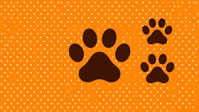 Paw prints on orange background with polka dots for animal theme