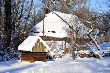 Old abandoned village, wooden houses, winter, snow, frost, tradition, difficult living conditions, Eastern Europe