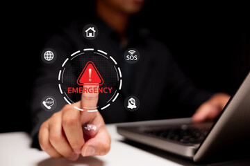 A person touching an emergency alert icon on a digital interface, emphasizing the importance of quick response in critical situations.
