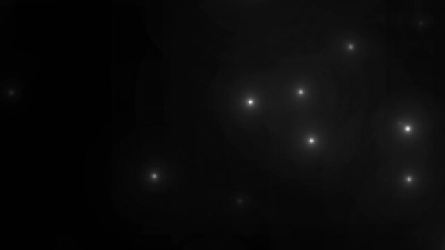 Paparazzi flashes of cameras on a black background. Camera flashes light animation overlay. Cinematic random bright blinking lights. The concept of popularity- Flashing lens flares seamless looping.