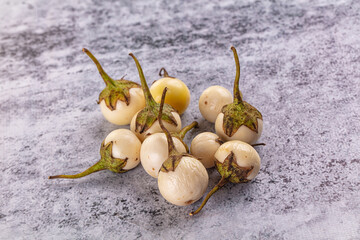 Raw white small baby eggplant