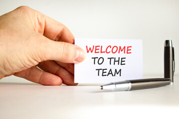 Support, help welcome to the team symbol. Concept words Welcome to the team on beautiful white card. Beautiful white background. Businessman's hand. Business welcome to the team concept. Copy space.