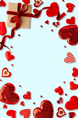 Romantic Valentine's Day Frame with Red Hearts and Gift Box on Light Blue Background