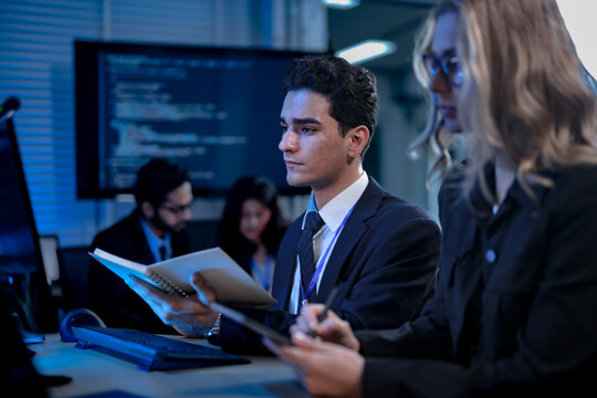 Two software developers smile with satisfaction during a pair programming session, as one points to a successfully executed block of code after solving a complex programming problem. - Powered by Adobe