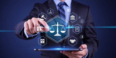 Businessman interacting with digital law icons on tablet in office