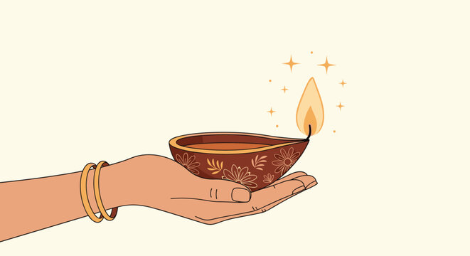 Woman's hand decorated with bangles holding a traditional lit diya oil lamp for the Diwali festival of lights celebration.