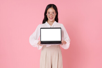 Asian business woman showcasing laptop blank screen digital workspace concept to represent online services technology solutions user interface design and efficient digital communication
