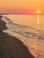 Sunrise Over Calm Ocean Waters