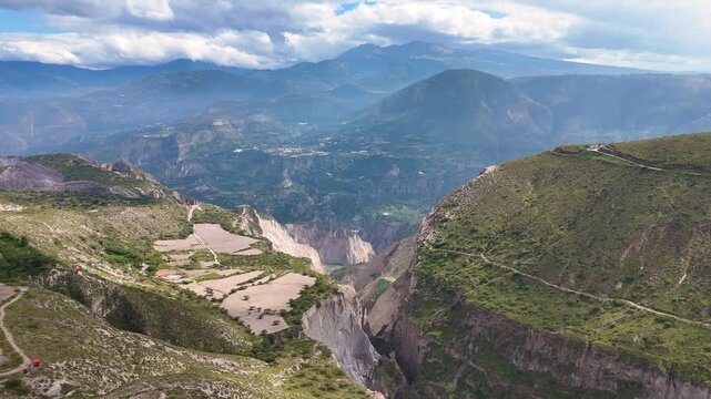 Aerial drone footage of a mountain ravine near the Pucar&aacute; de Rumicucho archaeological site in Ecuador. Natural Andean landscape with rugged terrain and vegetation, ideal for nature documentaries, trav
