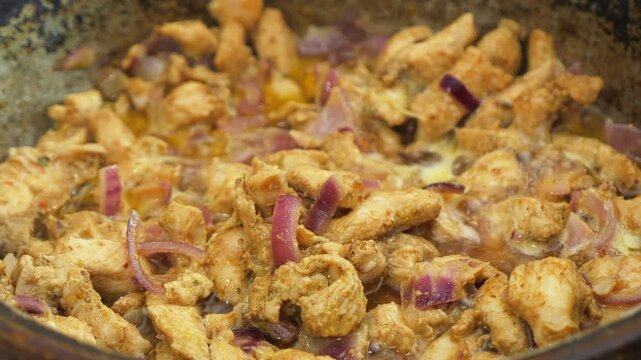 Chicken marinated in teriyaki sauce and spices is fried in a deep cast-iron skillet