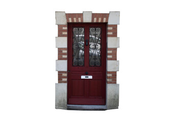 Naklejka premium Puerta de entrada residencial de madera roja con marco de ladrillo y piedra