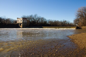 Abandoned municipal pump house on a river