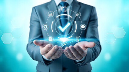 Businessman holding a holographic interface displaying a checkmark and icons representing business processes, signifying success and quality assurance