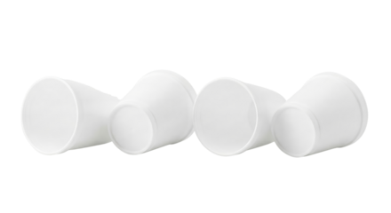 Four White Disposable Paper Cups Lying Down Isolated on White Background