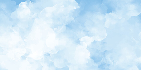 A calming and serene view of a bright blue sky filled with fluffy white clouds forming a peaceful backdrop