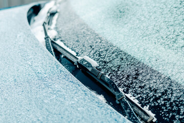Frozen car window and door seal in winter