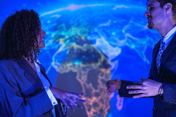 Corporate security experts discussing digital safety strategy. Business partners analyzing network protection and privacy lock concept in modern blue tech office.