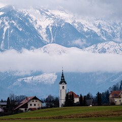 Parish Church of Saint Margaret Towered by Kamnik-Savinja Alps