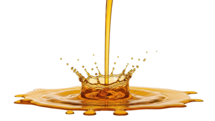 Golden liquid splashing into pool creating crown shape with stream pouring down