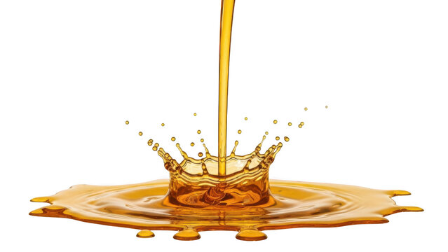 Golden liquid splashing into pool creating crown shape with stream pouring down