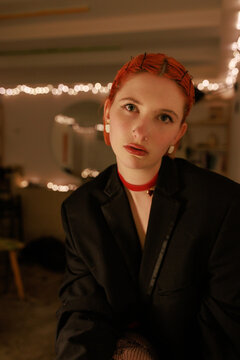 Moody low light portrait of a woman wearing black
