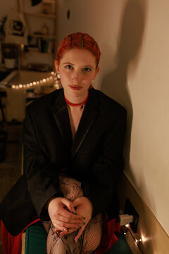 Moody low light portrait of a woman wearing black