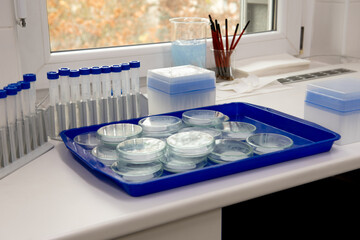 Microbiology laboratory equipment on a white table.