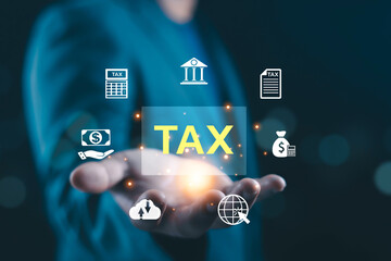 Businessman holding virtual tax interface with digital icons, online tax management concept, business finance, accounting system, government taxation, financial planning, fintech technology